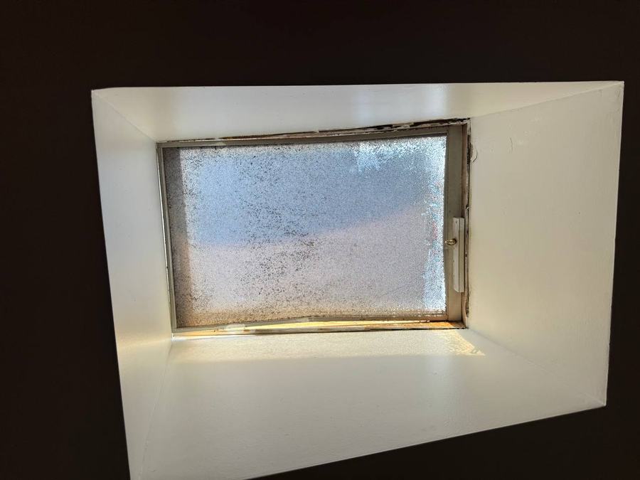 Foggy double pane window with a failed seal and moisture between the panes