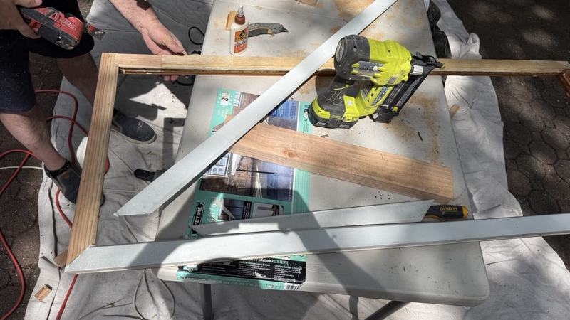 WindowServ technician cutting a window sash component in the shop