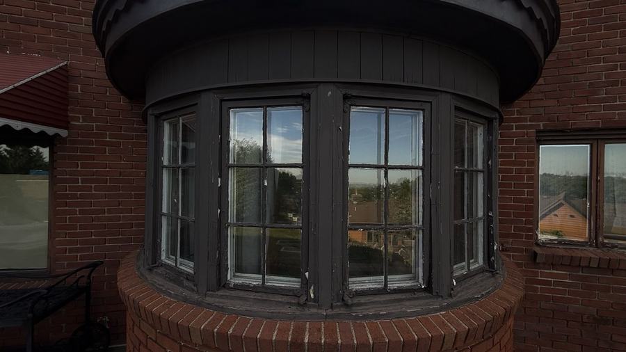 Curved bay windows on a brick home in Essex County, New Jersey