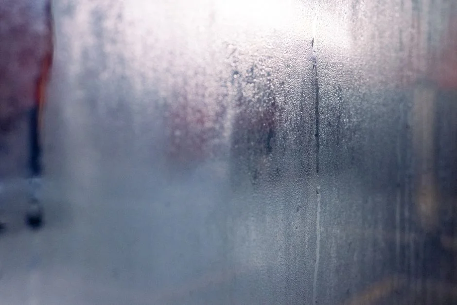 foggy double pane window with condensation between the glass panes