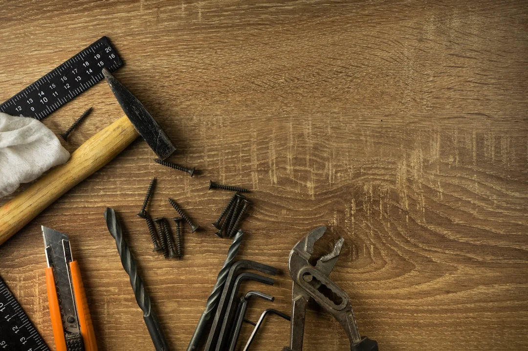 tools laid out for a DIY roofing project including sealant and utility knife