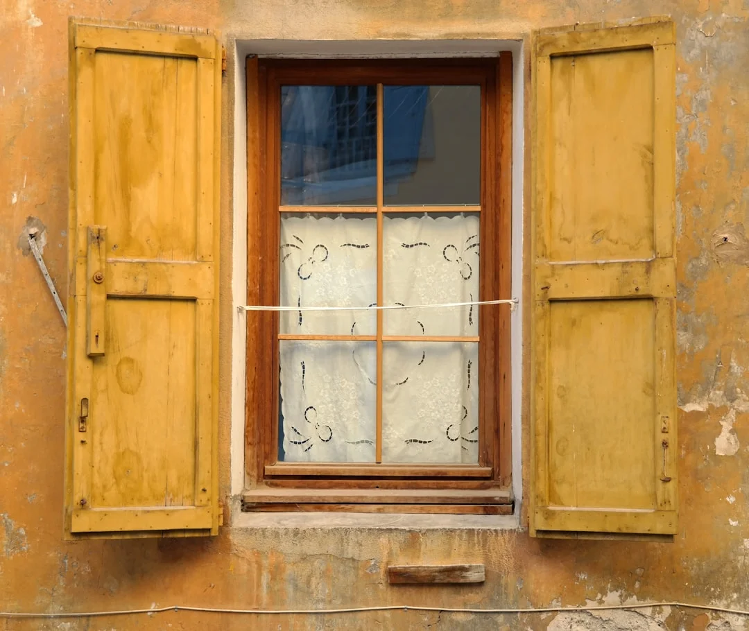 Professional steam box being used to safely soften old glazing putty and paint on a wood sash