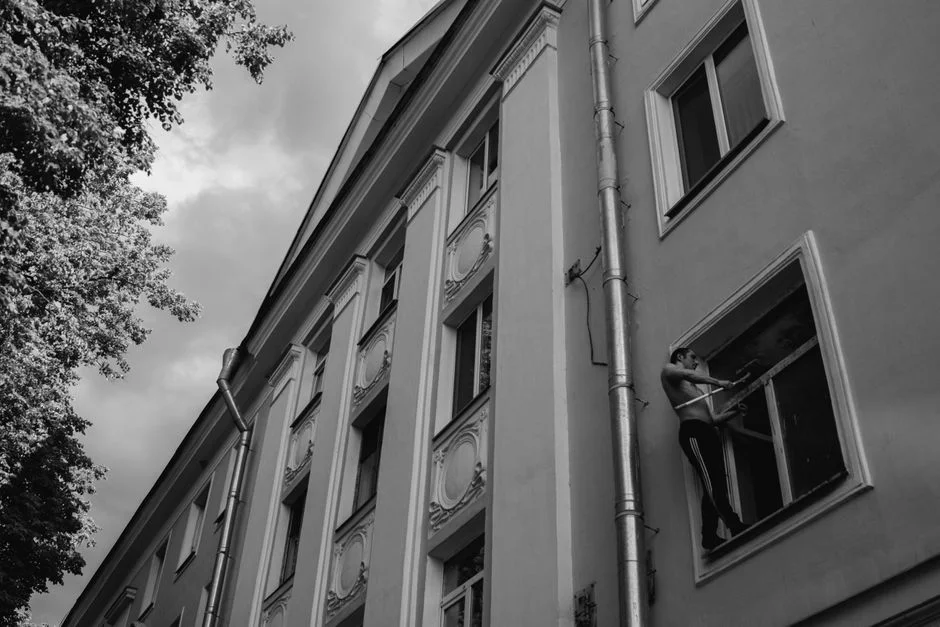 IMAGE of a person lubricating window tracks